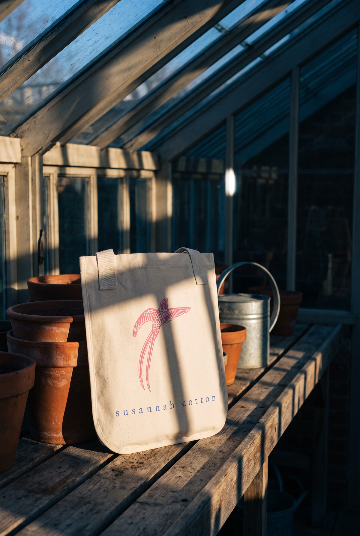 Bird tote on a potting bench in a glasshouse