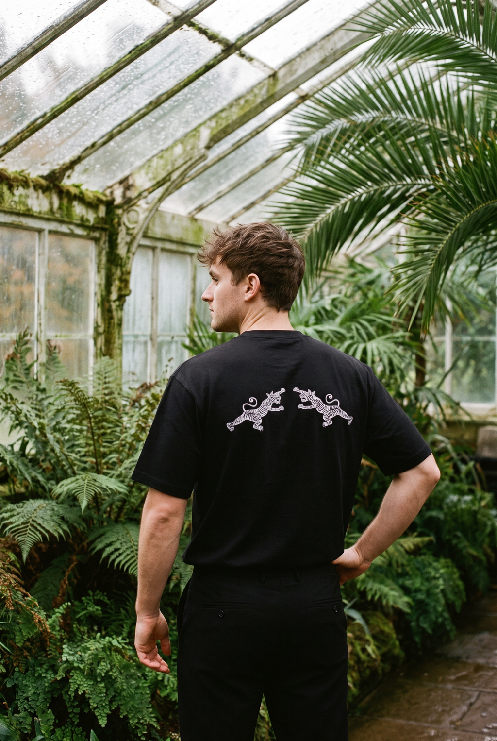 Back of the black Bird of Paradise tee showing the facing tigers print
